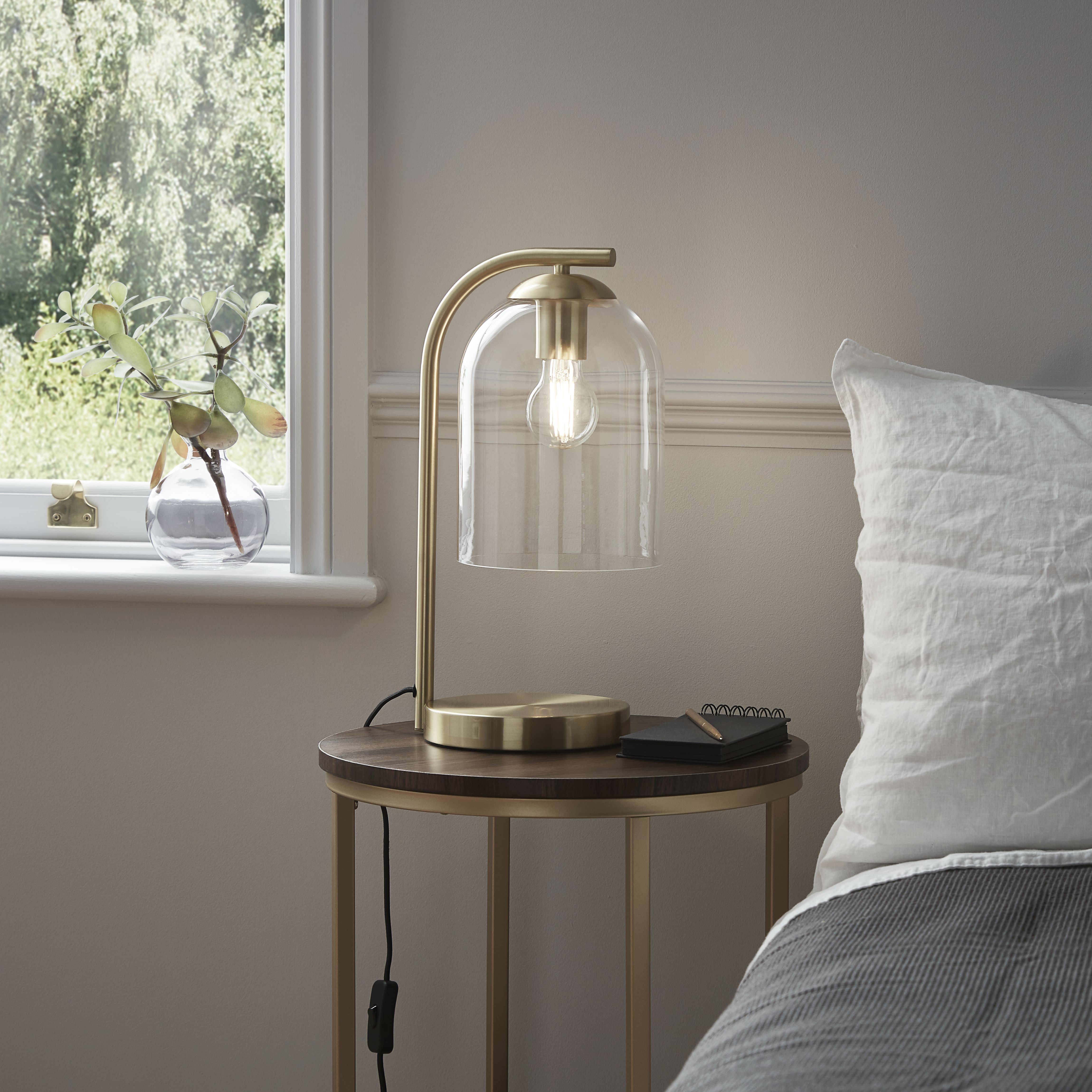 Brass effect store table lamp