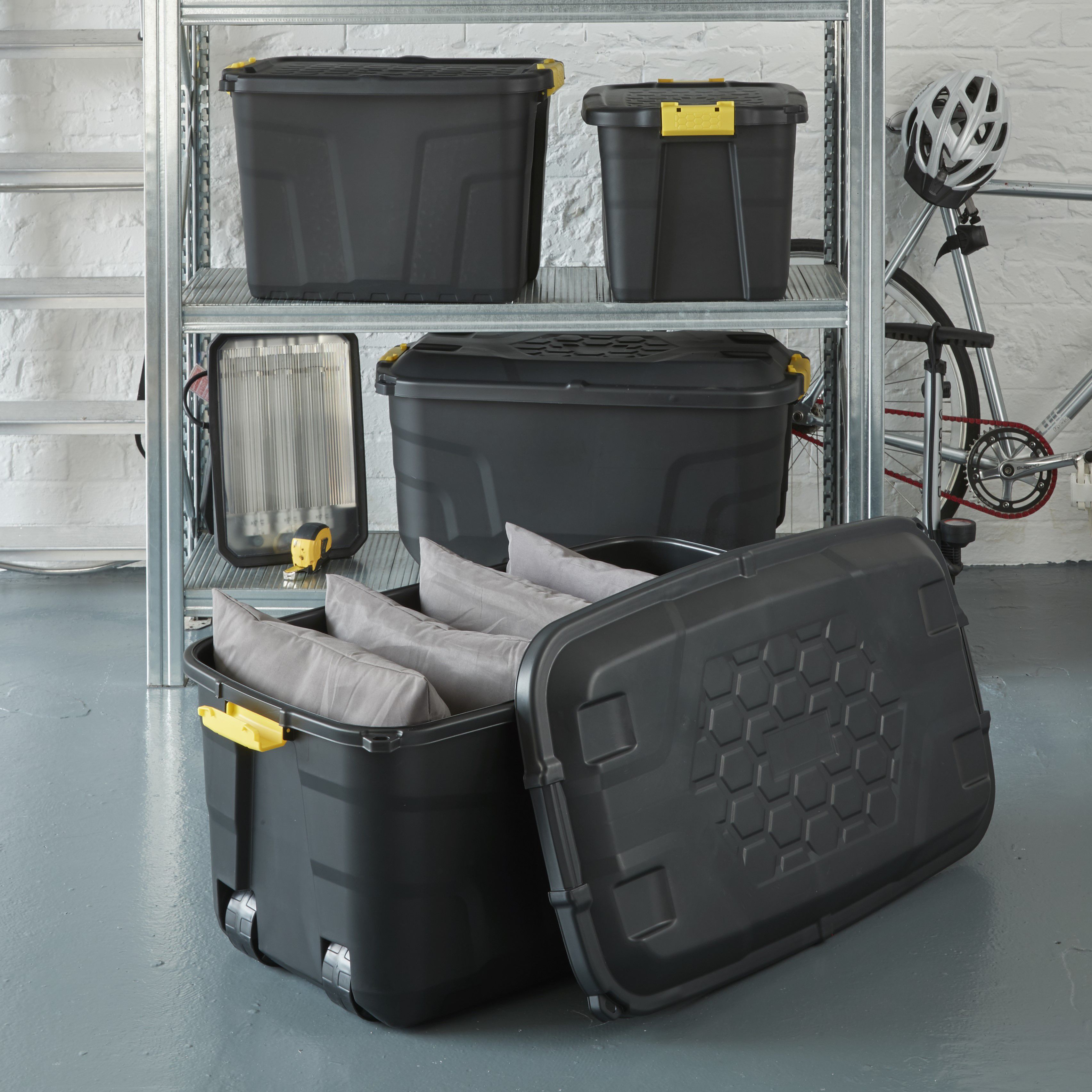 Strata Heavy duty Black 145L Large Plastic Stackable Wheeled Storage trunk with Lid