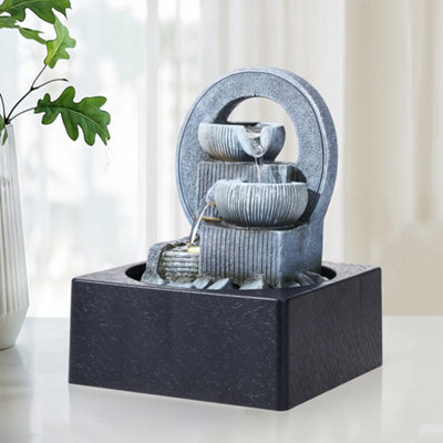 Darphe High Quality Resin Waterfall Tabletop Fountain With Warm Yellow Led Lighting from B&Q
