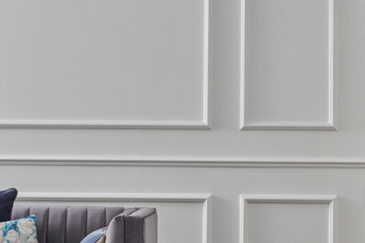 Victorian style wall panelling with ornate square details finished in white.