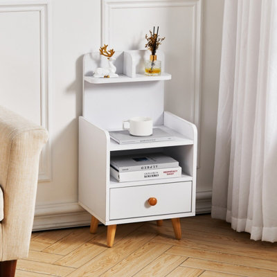 Darphe White Wooden 1 Drawer Bedside Table Nightstand With A Shelf And Wooden Legs from B&Q