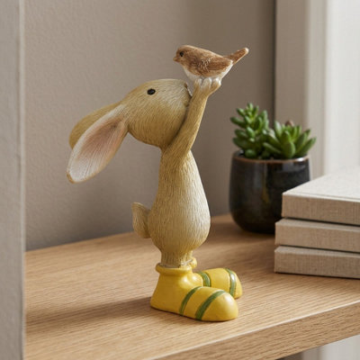 Garden Greatness Spring Rabbit Holding Bird Ornament from B&Q