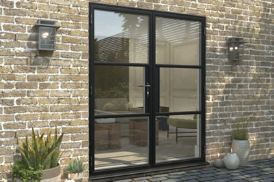 An exterior home wall with double glazed aluminium french doors