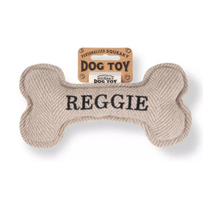 History & Heraldry Pre Personalised Squeaky Bone Dog Toy  Reggie from B&Q