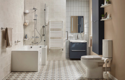 Modern accessible family bathroom in beige, featuring a walk-in shower bath, close-coupled rimless toilet, matt blue wall cabinet and vanity unit, white towel radiator, and chrome accessories.