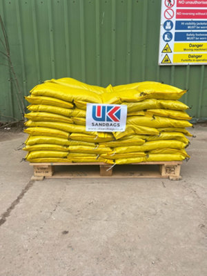 10 Filled yellow polypropylene sandbags