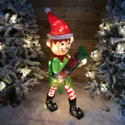 https://media.diy.com/is/image/KingfisherDigital/107cm-warm-white-led-lit-elf-character-with-present-christmas-decoration-in-green-and-red~5056589113674_01c_MP?$MOB_PREV$&$width=618&$height=618