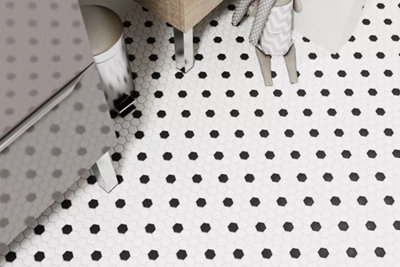 Black and white mosaic bathroom floor tiles.