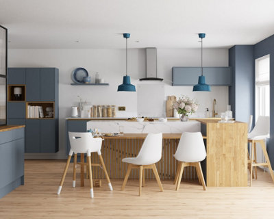 Large white and blue open plan kitchen living area with a large breakfast bar area suitable for big families.