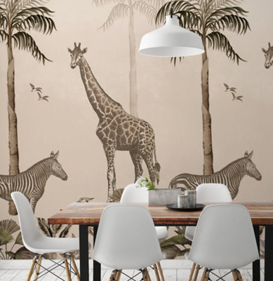 A dining room with cream safari wallpaper featuring giraffes and zebras, paired with a wooden dining table with black metal legs and white chairs.