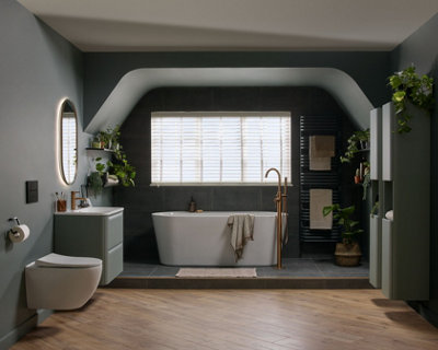 A dark green bathroom with sloped ceilings and light wood effect flooring to brighten the space.