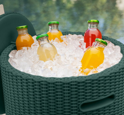 Drinks cooler filled with ice and bottles of juice.