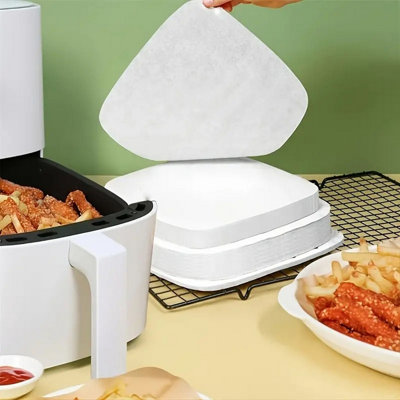 https://media.diy.com/is/image/KingfisherDigital/20-air-fryer-liner-sheets-square-greaseproof-parchment-paper-disposable-20cm~5053249260013_03c_MP?$MOB_PREV$&$width=618&$height=618