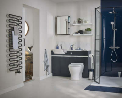 A large white and blue bathroom with white floating shelves above the toilet and basin unit.