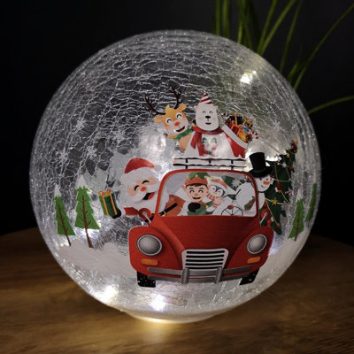 20cm Battery Operated Twinkling Warm White LED Crackle Effect Ball Decoration with Santa and Friends in Car