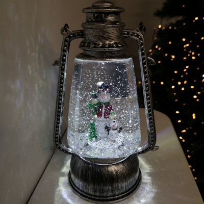 24cm Premier Christmas  Water Spinner Antique Silver Effect Hurricane Lantern Style with Snowman & Penguin Scene