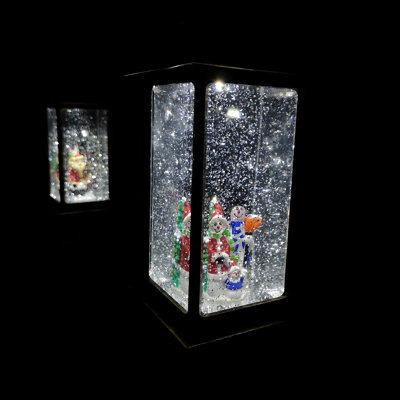 RAZ Imports Lanterna Acquatica Con Scena Di Città, 27,9 Cm, Con Glitter Danzanti E Timer 6/18 Ore, Luci LED, Richiede 3 Batterie C, Colore Bianco/Acqua
