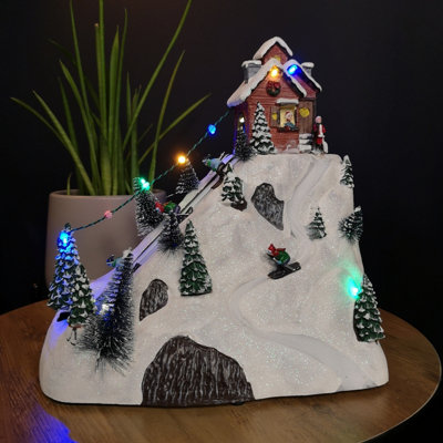 29cm Light up Animated Snowy Ski Cabin Christmas Mountain Village Scene with LEDs