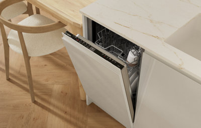 The Garcinia kitchen features glossy slab doors with integrated handles in a light tone, complemented by marble-effect worktops for a bright, contemporary feel.