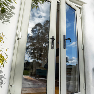 Traditional style patio doors with dark handles and grey frames.