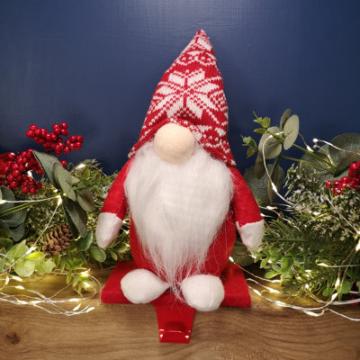 https://media.diy.com/is/image/KingfisherDigital/30cm-plush-gnome-gonk-christmas-stocking-holder-decoration-with-red-body-and-hat~5056589113575_01c_MP?$MOB_PREV$&$width=618&$height=618