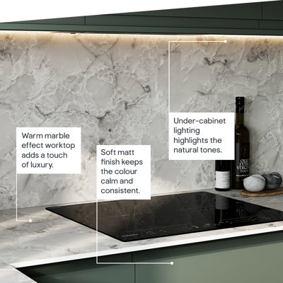 The Garcinia kitchen features matt slab doors with integrated handles in a deep tone, complemented by ribbed glazed wall units for a calm, contemporary look.
