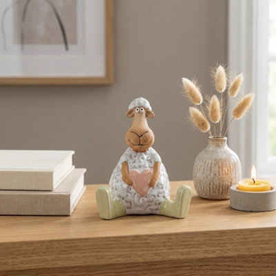 Garden Greatness Sitting Sheep Holding Heart Ornament from B&Q