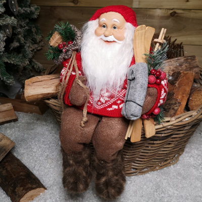 33cm Sitting Father Christmas Santa Claus Figurine Holding Skis
