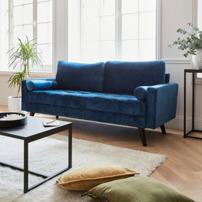 Sweeek. Velvet Vintage Style 3-Seater Sofa With Scandi Style Wooden LegsIvarBlue from B&Q