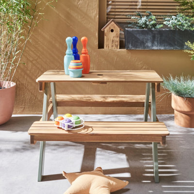 Sweeek. 2-Seater Wooden Picnic Table For Children Caroline Sage Green 71X35.5X50 Cm