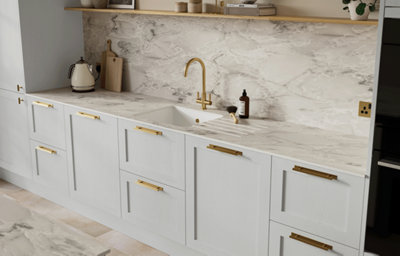 Light grey shaker style kitchen cabinets.
