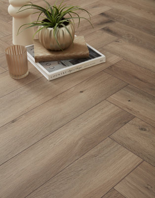 Swiss Krono HerringboneMetz Oak 8mm Laminate Flooring. 1.23M² Pack from B&Q