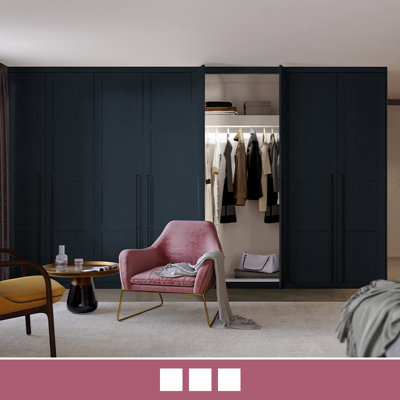 A striking four-panel shaker style wardrobe in a deep blue colour.