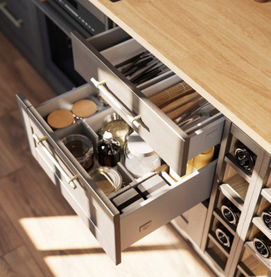 Close up of open drawers in a kitchen.