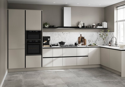 A light grey kitchen with light grey concrete effect porcelain floor tiles.