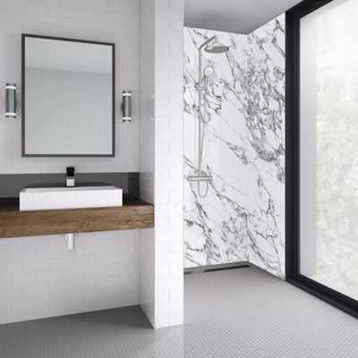 A wetroom shower with no enclosure or tray between the shower space and the rest of the bathroom.