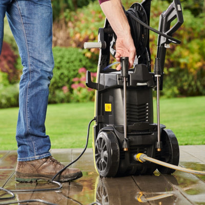 Cleaning patio with a pressure washer