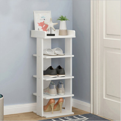 White wooden shop shoe storage