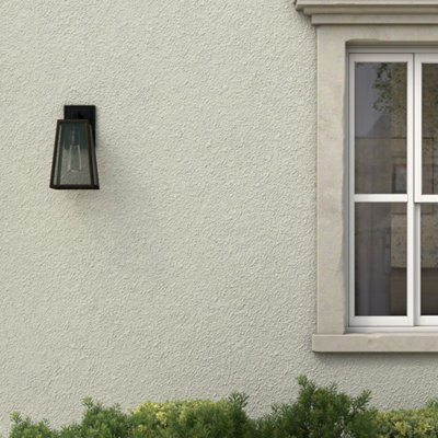 Light masonry paint on stone wall