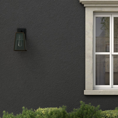 Black masonry paint on stone wall