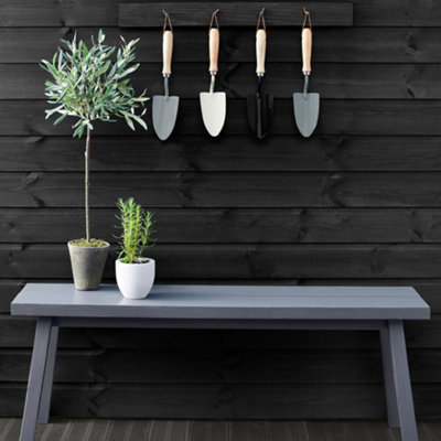 Garden shed painted with dark exterior wood paint