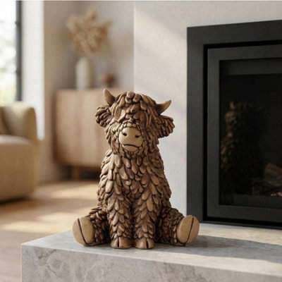 Sitting Hughie Highland Cow Ornament from B&Q