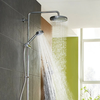 A shower with a handheld shower head and a fixed shower head running at the same time.