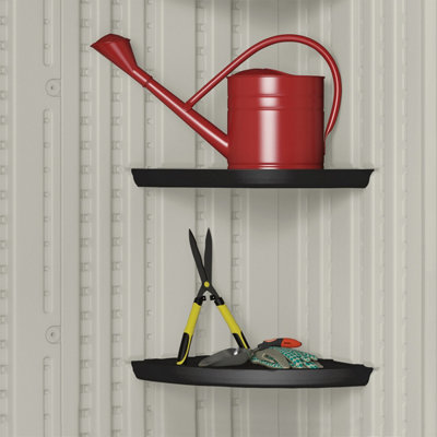 Wall-mounted shed shelving used for organising gardening tools