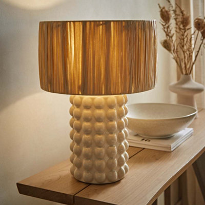 Valuelights Kiran Stone Bobble Ceramic Bedside Table Lamp With Natural Raffia Shade from B&Q