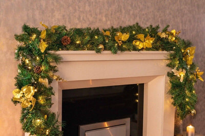9Ft Pre-Lit Artificial Christmas Garland With Gold Decor from B&Q