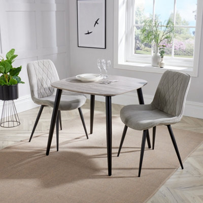 Core Products Aspen Grey Oak Effect 80Cm Square Dining Table With 2 Light Grey Cord Fabric Diamond Stitch Design Chairs from B&Q