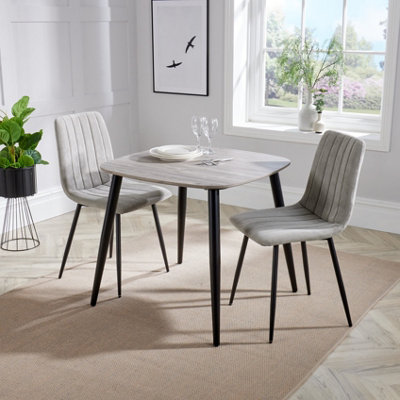 Core Products Aspen Grey Oak Effect 80Cm Square Dining Table With 2 Light Grey Cord Fabric Straight Stitch Design Chairs from B&Q