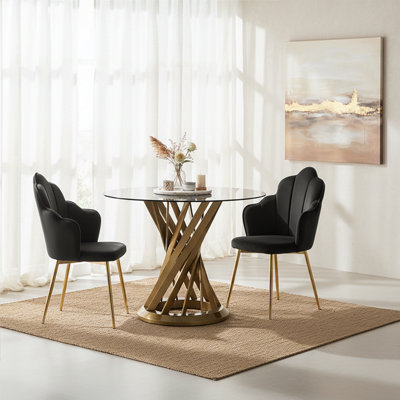 Orsina Black Glass And Gold Hourglass Base Dining TableModern Black And Gold Round Dining Table For Modern Homes from B&Q