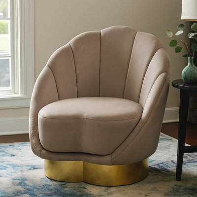 Orsina Mink Velvet Accent ChairMink Velvet Upholstery With Scalloped Shell DesignGold Finish Curved Base from B&Q